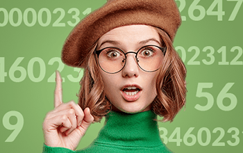 young female in glasses and hat pointing upward